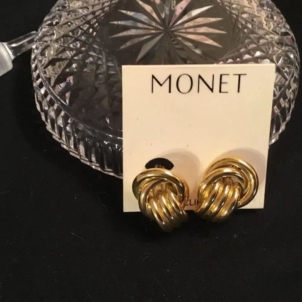 NWT. Money Goldtone Twister Door Knocker Cliip Earrings